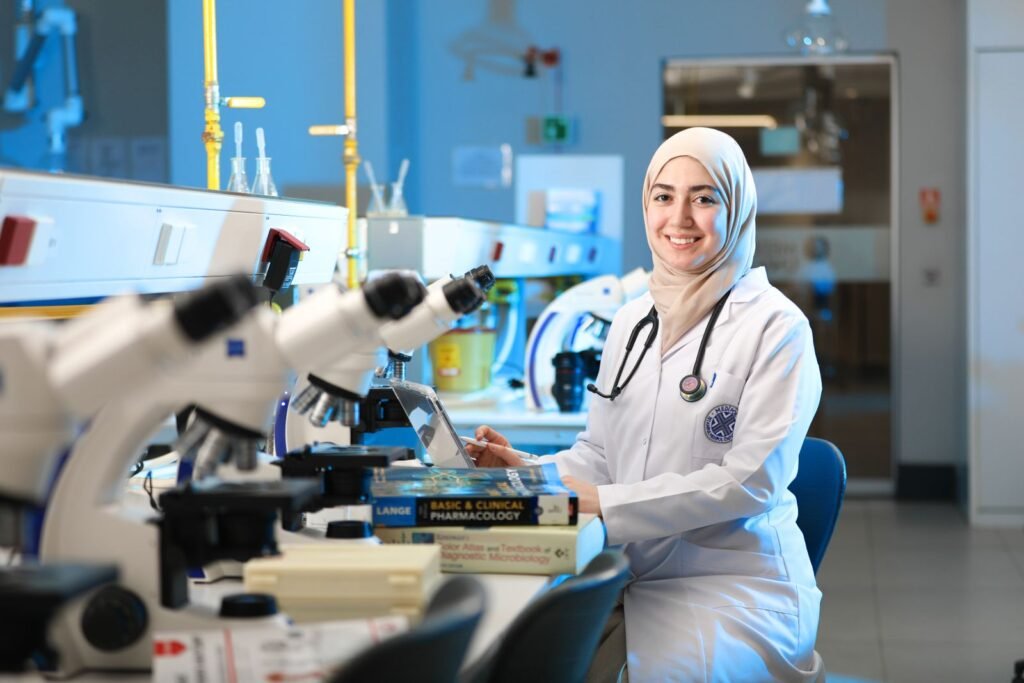 Laboratory specialist working with microscopes