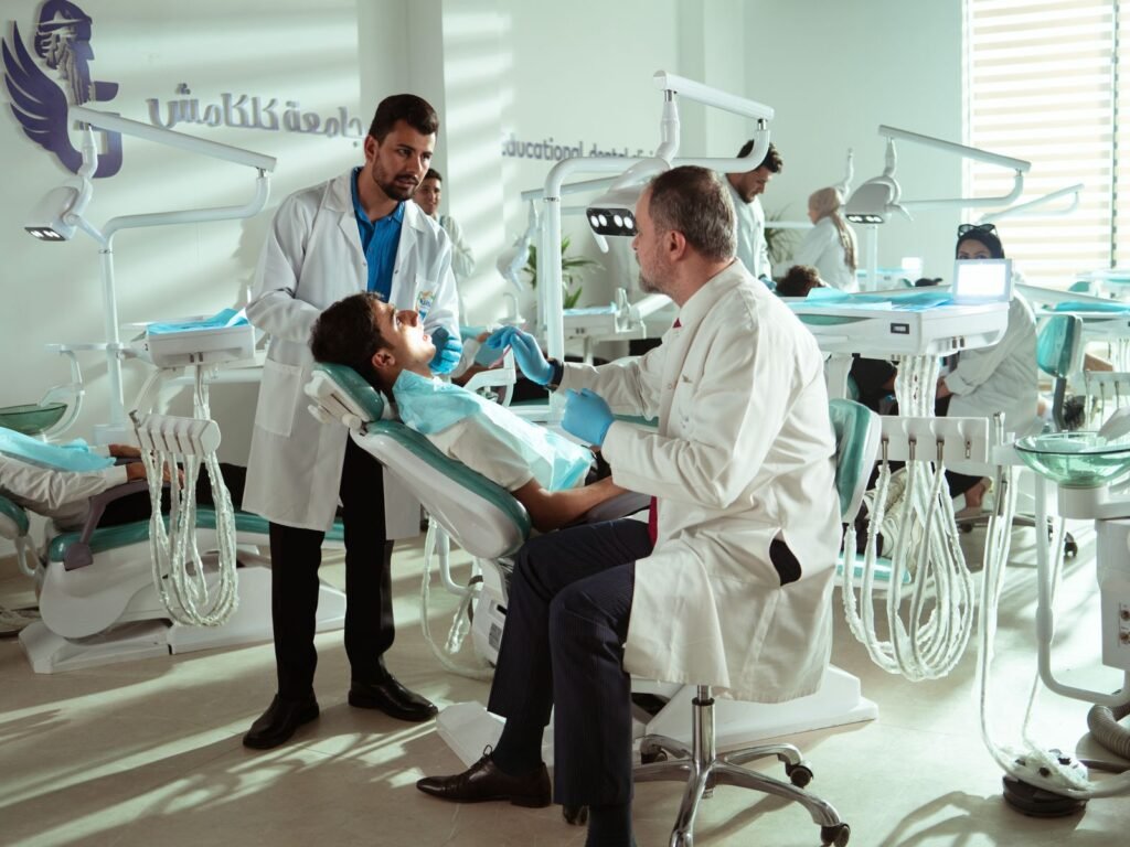 Dentists treating a patient in a dental clinic